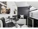 Finished basement with a chic black and white design and a built-in bar at 1581 Forest Ave, Winter Park, FL 32789