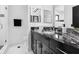 Sleek bathroom with a stylish design features dark wood cabinets and modern finishes at 1581 Forest Ave, Winter Park, FL 32789