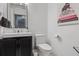 Modern bathroom with sleek vanity, framed mirror, and stylish decorative accents at 1581 Forest Ave, Winter Park, FL 32789