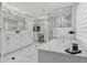 Bright bathroom features a soaking tub, a glass-enclosed shower, double vanity, and ample storage at 1581 Forest Ave, Winter Park, FL 32789