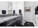 Modern bathroom features granite countertops, a glass-enclosed shower, and dark wood cabinets at 1581 Forest Ave, Winter Park, FL 32789