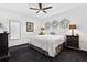 Bright bedroom with a minimalist design features dark wood nightstands at 1581 Forest Ave, Winter Park, FL 32789