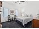 Cozy bedroom with gray accents features large windows and minimalist decor at 1581 Forest Ave, Winter Park, FL 32789