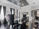 Bright dining room with elegant chandelier and black wood floors at 1581 Forest Ave, Winter Park, FL 32789