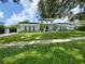 Beautiful modern home with clean lines, manicured landscaping, and a welcoming entrance at 1581 Forest Ave, Winter Park, FL 32789