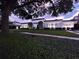 Beautiful home featuring a lush green lawn, manicured landscaping, and modern architectural design at 1581 Forest Ave, Winter Park, FL 32789