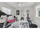 Bright home gym with treadmill, weights, and other exercise equipment for a complete workout at 1581 Forest Ave, Winter Park, FL 32789