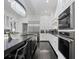 Gourmet kitchen features stainless steel appliances, granite countertops, and a large island with seating at 1581 Forest Ave, Winter Park, FL 32789