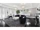 Spacious living room with designer furniture and a patterned rug at 1581 Forest Ave, Winter Park, FL 32789