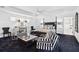 Large main bedroom with ceiling fan, sitting area and attached ensuite at 1581 Forest Ave, Winter Park, FL 32789