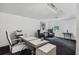 Bright office space with white walls features modern lighting and minimalist decor at 1581 Forest Ave, Winter Park, FL 32789