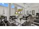 Stylish outdoor living area with comfortable seating overlooking the swimming pool and landscaped yard at 1581 Forest Ave, Winter Park, FL 32789