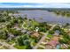 Picturesque property with proximity to a serene lake, surrounded by lush greenery and charming neighborhood homes at 2699 Travida Dr, Deltona, FL 32738