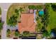 Spacious home with a backyard featuring mature trees and a relaxing pool, ideal for outdoor entertainment and leisure at 2699 Travida Dr, Deltona, FL 32738