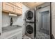 Convenient laundry room with modern washer/dryer, ample cabinet space, and a stylish sink, perfect for efficient chores at 2699 Travida Dr, Deltona, FL 32738
