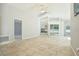 Bright living room with large windows, tile flooring, ceiling fan, and neutral paint at 4382 Weeping Willow Cir, Casselberry, FL 32707