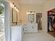 Bright bathroom with double vanity, modern fixtures, and ample natural light at 554 Estates Pl, Longwood, FL 32779