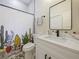 Bathroom features patterned tile, patterned shower curtain, and white sink at 554 Estates Pl, Longwood, FL 32779