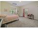 Comfortable bedroom with carpet floors, windows, and neutral decor at 554 Estates Pl, Longwood, FL 32779