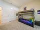 Comfortable bedroom featuring a bunk bed, closet, and carpet flooring at 554 Estates Pl, Longwood, FL 32779