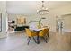 Open floorplan with dining and living spaces, enhanced by natural light and stylish furnishings at 554 Estates Pl, Longwood, FL 32779