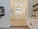 Bright foyer with modern chandelier, featuring hardwood floors, white double doors, and a stylish entrance at 554 Estates Pl, Longwood, FL 32779