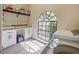 Well-lit laundry room with ample counter space, storage cabinets and bright windows at 554 Estates Pl, Longwood, FL 32779