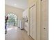 Bright laundry room with white cabinets, modern washer and dryer, and a window with a view at 554 Estates Pl, Longwood, FL 32779