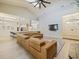 Spacious living room with modern fireplace, featuring hardwood floors, a comfortable leather sectional, and open-concept design at 554 Estates Pl, Longwood, FL 32779