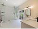 Modern bathroom with large walk-in shower, dual vanity, and neutral tones at 554 Estates Pl, Longwood, FL 32779