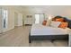 Stylish bedroom with barn door, featuring a comfortable bed and plenty of natural light at 554 Estates Pl, Longwood, FL 32779