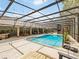 A large outdoor pool with plenty of lounge space and access to the house through multiple points at 554 Estates Pl, Longwood, FL 32779