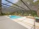 Wide open view of the pool with lounge chairs and plenty of space in the screened in enclosure at 554 Estates Pl, Longwood, FL 32779