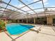 An elevated view of a large pool area and outdoor living space, fully enclosed for privacy at 554 Estates Pl, Longwood, FL 32779