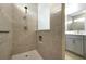 Stylish shower with mosaic tile accents, a handheld showerhead, and a glass partition at 10002 Brown Burrow St, Orlando, FL 32829