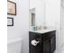 Cozy bathroom featuring a black vanity with a white countertop and a framed mirror at 1013 Leader St, Davenport, FL 33896
