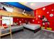 Whimsical bedroom adorned with vibrant Mickey Mouse decor, bunk beds, and playful accents at 1013 Leader St, Davenport, FL 33896