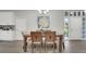Inviting dining area with modern decor, bathed in natural light, and conveniently located near the entry at 1027 Dees Dr, Oviedo, FL 32765