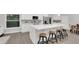 Modern, fully-equipped kitchen with an island and four stools, perfect for dining and entertaining at 1027 Dees Dr, Oviedo, FL 32765