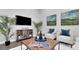 Cozy living room with a curated display of decorations and plants, creating a warm, inviting space at 1027 Dees Dr, Oviedo, FL 32765