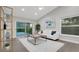 Inviting living room with a cozy atmosphere and a view of the patio and lush backyard at 1027 Dees Dr, Oviedo, FL 32765