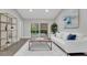 Cozy living room with stylish furniture, bright white rug, and sliding door access to the outdoor pool at 1027 Dees Dr, Oviedo, FL 32765