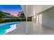 Exterior of the home highlighting the patio view of the pool and house including sunset at 1027 Dees Dr, Oviedo, FL 32765