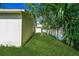Backyard with lush green grass, featuring a privacy fence at 1073 Hamlet Dr, Maitland, FL 32751