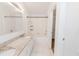 Bathroom with granite countertop vanity, bathtub with shower, and tiled floors at 1073 Hamlet Dr, Maitland, FL 32751