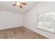Bedroom showcasing a ceiling fan, window with blinds, and neutral colored carpet at 1073 Hamlet Dr, Maitland, FL 32751