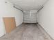 Spacious garage with gray door at 1073 Hamlet Dr, Maitland, FL 32751