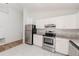 Well-equipped kitchen with stainless steel appliances, granite countertops, and tiled flooring at 1073 Hamlet Dr, Maitland, FL 32751