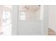 Bright living room features an arched window, ceiling fan, and tile floors at 1073 Hamlet Dr, Maitland, FL 32751
