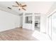 Spacious living area featuring wood-look floors, modern ceiling fan, and neutral decor at 1073 Hamlet Dr, Maitland, FL 32751